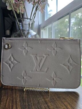 Louis Vuitton Neverfull Pochette Giant Monogram Empreinte Leather in Beige